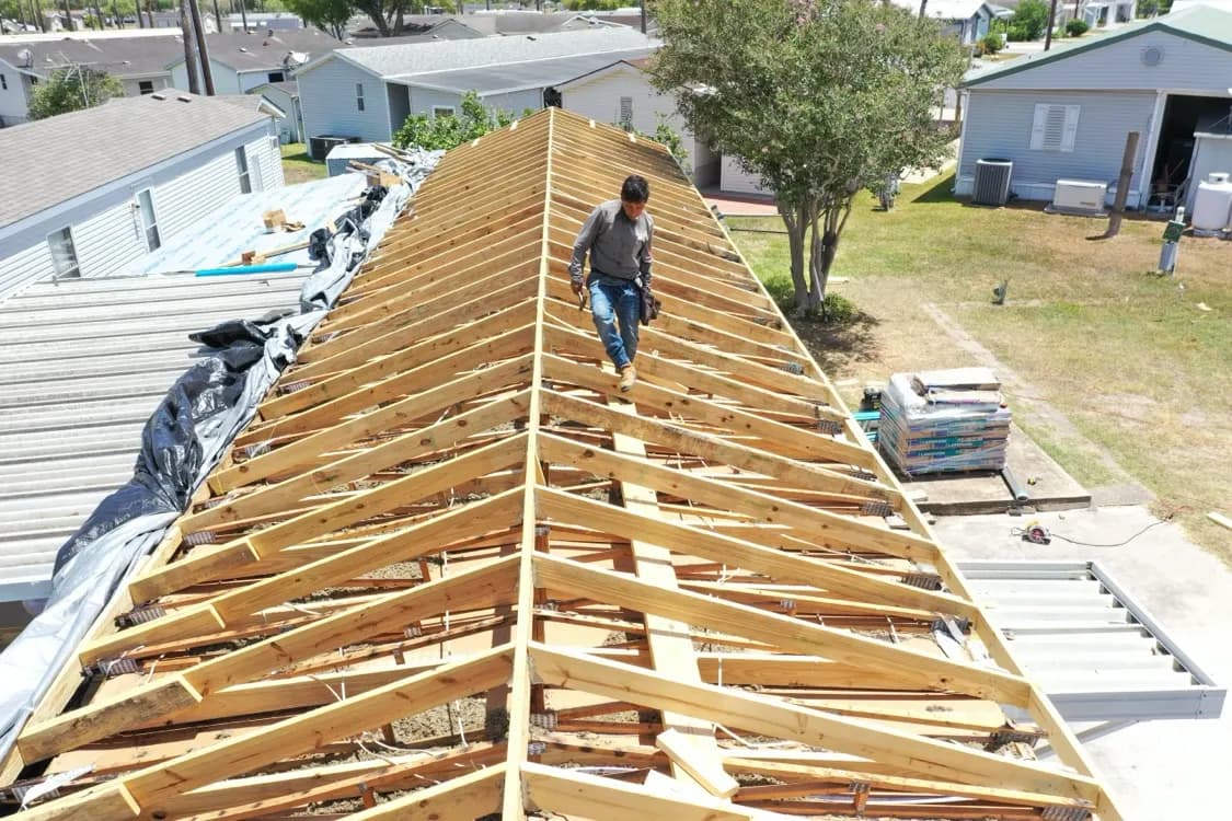 New roof framing built to raise the pitch on the mobile home