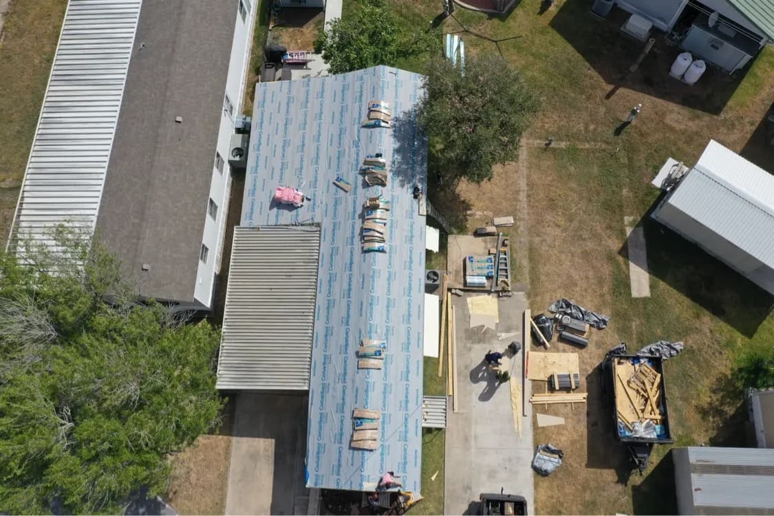 CertainTeed underlayment on the new roof with shingle bundles staged