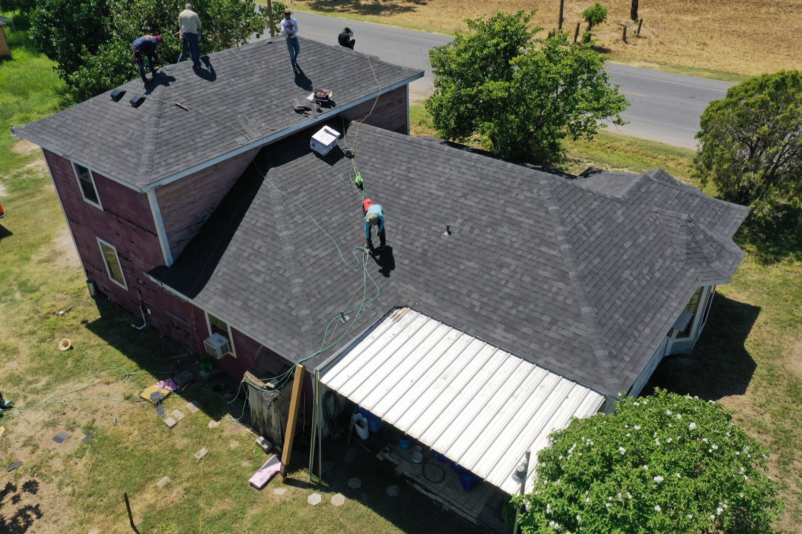 Texas Contractors crew completing a full roof replacement in the Rio Grande Valley