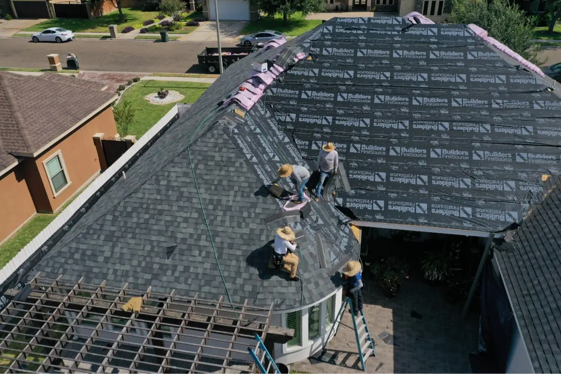 Crew installing shingles on a hail claim roof in Mission