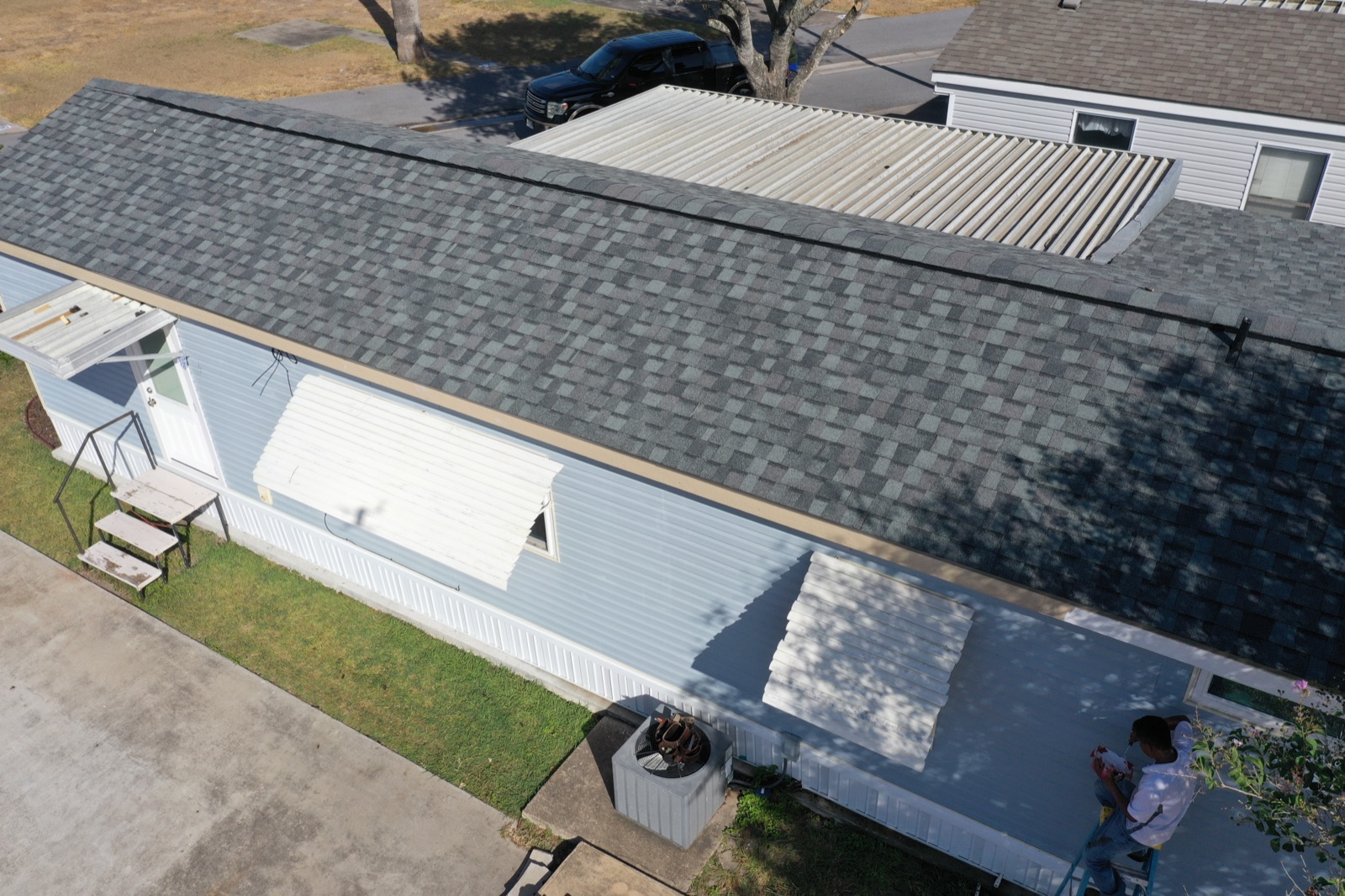 Finishing details and flashing work on a completed roof